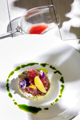 Salad with tuna, lemon, sorrel, violet, sesame, tobiko caviar, sauce, avocado, cucumber and mayonnaise