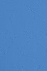 Saturated pastel blue colored low contrast Concrete textured background. Empty colourful wall texture with copy space for text overlay and mockups. 2023, 2024 color trend