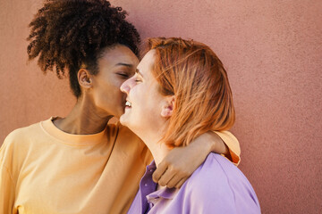 Happy women gay couple having tender moment outdoor - Lgbt and love concept