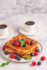 French toast with blueberries, raspberries, maple syrup