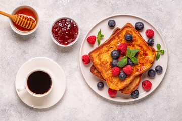 French toast with blueberries, raspberries, maple syrup