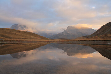 Obraz premium Amazing reflections in lake Plan du Lac Bellecombe looking towards La Grande Casse in the French alps