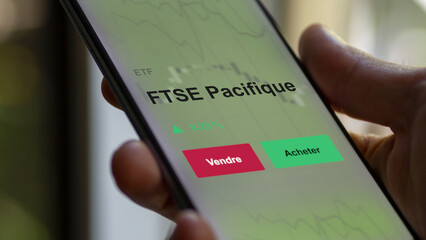 Un investisseur analyse un fonds etf ftse pacifique sur un graphique. Un téléphone affiche le cours de l'ETF. Texte en français francais FTSE Pacifique