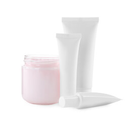 Jar and tubes of hand cream on white background