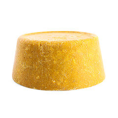 Yellow solid shampoo isolated on white. Hair care