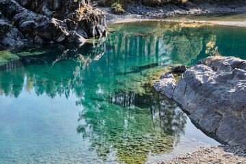 Turquoise clear water in a mountain lake. Autumn Altai.