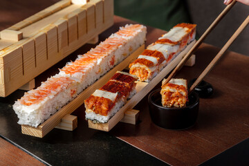 Preparation for rolls with rice, shrimps, eel