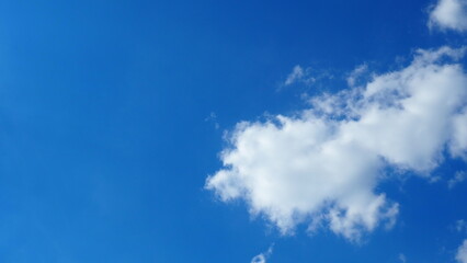 background clouds in a blue sky on a clear sunny day