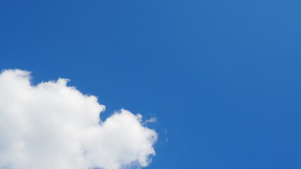 background clouds in a blue sky on a clear sunny day