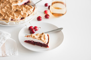 Plate with tasty cherry pie on white background. Top view