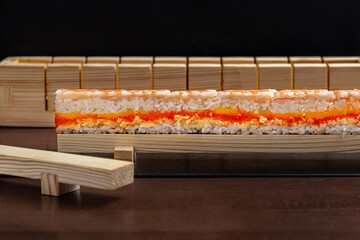 Preparation for rolls with rice, shrimps, yuzo tobiko