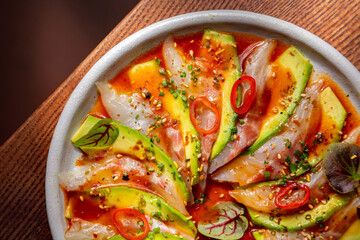 Sashimi with squid meat, avocado, octopus, sesame seeds