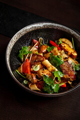 Salad with squid meat on skewers, mushrooms
