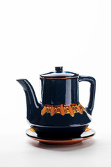 Colored ceramic teapot isolated on white background