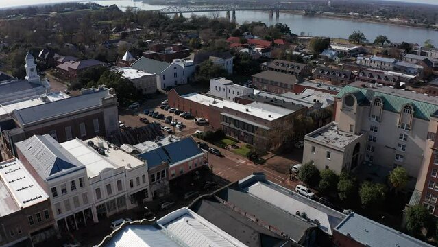 Aerial tilting up shot to reveal the Natchez-Vidalia bridge across the Mississippi River in Natchez, Mississippi. 4K