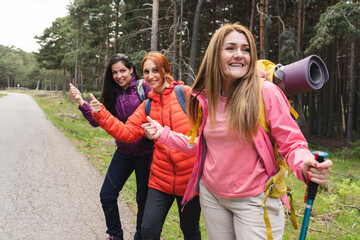 mature women hitchhiking. Diverse Backpacker Women Jumping The Street