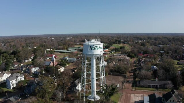 Wide panning aerial shot of the Natchez Watertower. 4K