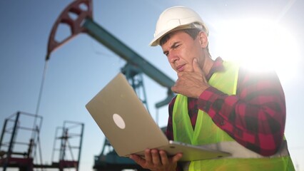 oil industry. engineer next to an oil rig. oil production business finance concept. gas production....