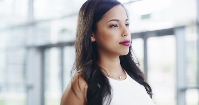Thumbs up from a beautiful, stylish and elegant woman for agreement, approval and good news walking through a modern office. Portrait of a professional looking pleased, happy and expressing thanks