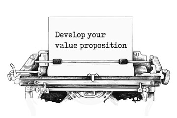 Text Develop your value proposition typed on retro typewriter
