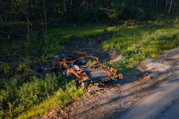 Fototapeta premium The war in Ukraine, Destroyed and burned russian battle tank of the Russian invaders in Ukraine 2022, Kiev region
