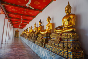 Row Of Buddha statue at "Wat Pho",that famous and popular tourist attraction in Bangkok Thailand.