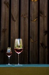 A glass of white wine. Minimalism. Glass with wine and berries, flowers. A glass of water.