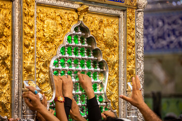 The shrine of Abbas, son of Imam Ali, peace be upon him, in Karbala, Iraq, with Imam Hussein, peace be upon him