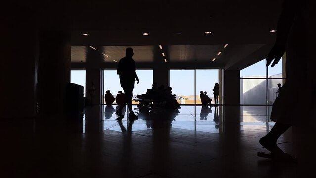 4k SlowMo - Images of a busy airport - silhouette - plane about to take off