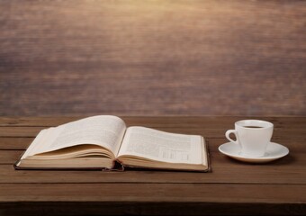 Retro antique journal with paper pages with a cup of tea on rustic wood