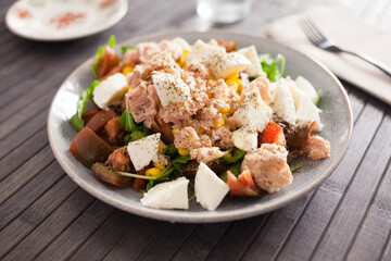 Closeup of salad with fish and vegetables for lunch