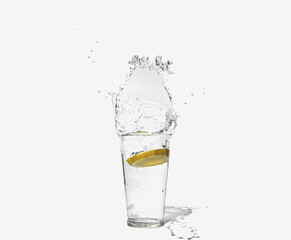 glass of clear water with a splash of lemon