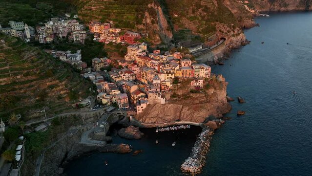 View from above, stunning aerial view of Manarola, the second village of the Cinque Terre coming from La Spezia. Manarola is the most picturesque village, made up of colorful tower-houses.