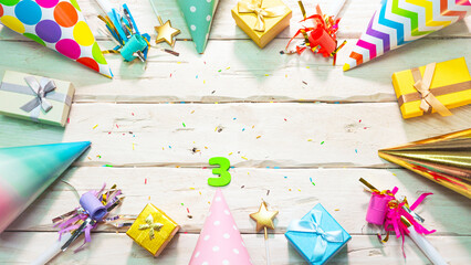 Beautiful colorful greeting card on the background of white boards happy birthday copy space. Beautiful ornaments and decorations festive background. Happy birthday number 3