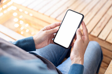 cell phone blank white screen mockup.hand holding texting using mobile on desk at office.background empty space for advertise.work people contact marketing business,technology