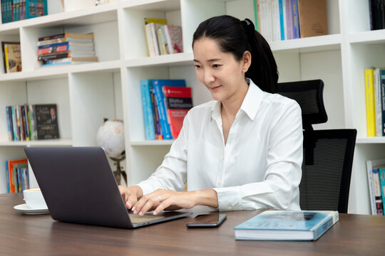 woman work using computer hand typing laptop keyboard contact us.student study learning education online.adult professional people chatting search at office.concept for technology device business