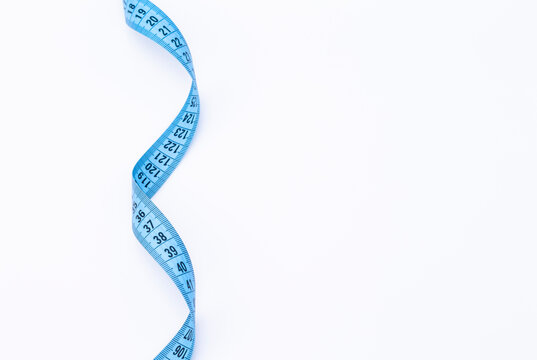 The photo shows a blue tape measure isolated on white background