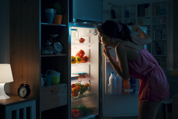 Woman looking in the fridge