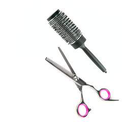 Thinning scissors and hairbrush isolated on white background. Free space for text.