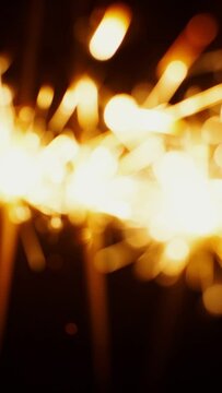 Blurred image of sparkling sparklers, abstract background