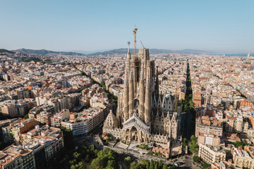 Aerial view shot of La Sagrada Familia Basilica Barcelona at sunrise. Cinematic 4K