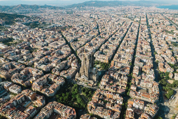 Aerial view shot of La Sagrada Familia Basilica Barcelona at sunrise. Cinematic 4K