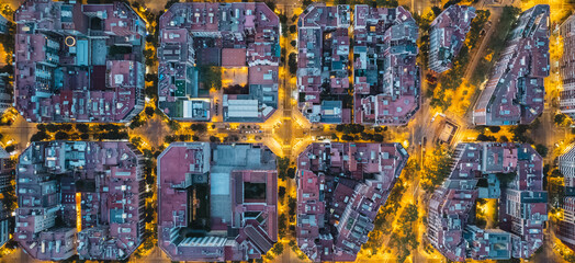 Barcelona overhead shot of typical city blocks in beautiful sunlight with urban traffic. Top view.