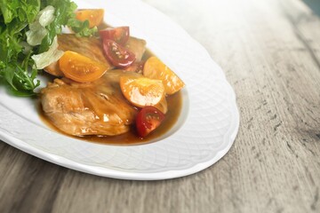 Sweet and sour pork of traditional gourmet cuisine meal food dish on the white serving plate