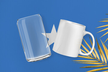 Patriotic can glass and mug mock up on background in colors of national flag. Somalia