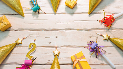 Beautiful colorful card on the background of white boards happy birthday in golden hues copy space. Beautiful ornaments and decorations of gold color festive background. Happy birthday number 2