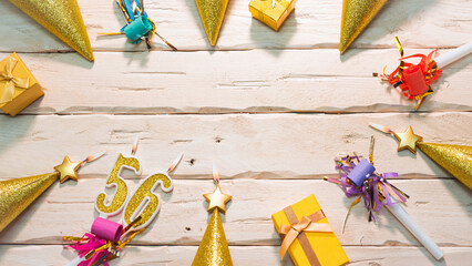 Beautiful colorful card on the background of white boards happy birthday in golden hues copy space. Beautiful ornaments and decorations of gold color festive background. Happy birthday number 56
