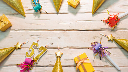 Beautiful colorful card on the background of white boards happy birthday in golden hues copy space. Beautiful ornaments and decorations of gold color festive background. Happy birthday number 57