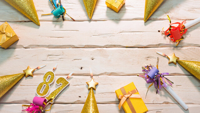 Beautiful colorful card on the background of white boards happy birthday in golden hues copy space. Beautiful ornaments and decorations of gold color festive background. Happy birthday number 87