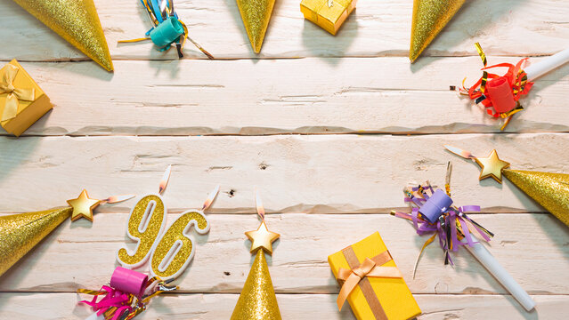 Beautiful colorful card on the background of white boards happy birthday in golden hues copy space. Beautiful ornaments and decorations of gold color festive background. Happy birthday number 96
